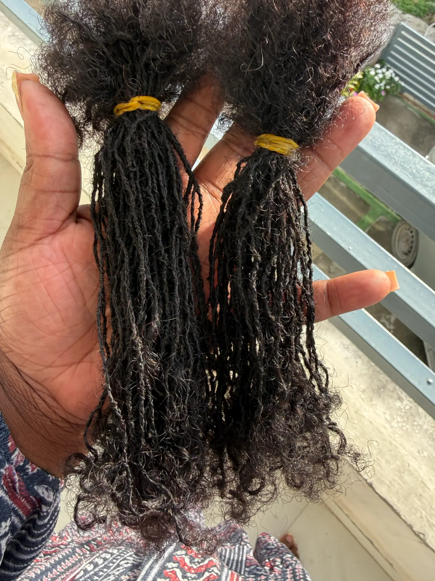 LOC VIDA handmade microloc extensions held in hand